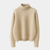 Beige/cream soft turtleneck sweater with ribbed turtleneck and cuffed sleeves.
