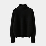 Black soft turtleneck sweater with ribbed collar, cuffs, and hem, long sleeve knit pullover.