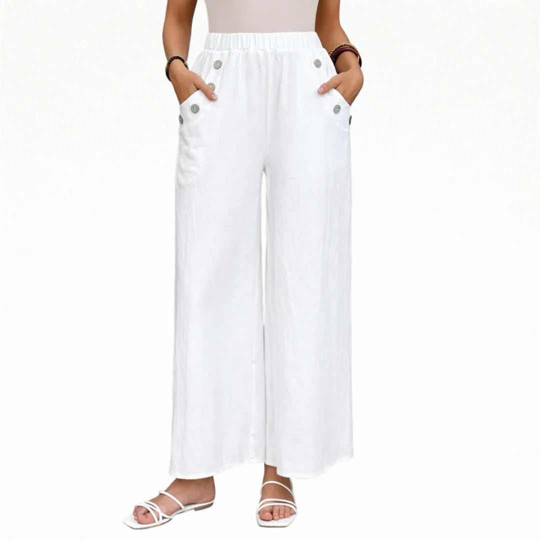 White wide-leg pants with elastic waistband and button-accent side pockets