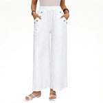 White wide-leg pants with elastic waistband and button-accent side pockets