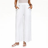 White wide-leg pants with elastic waistband and button-accent side pockets