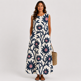 Sleeveless summer dress in navy and cream with red floral print, A-line