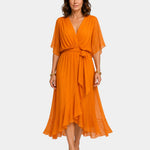 Orange chiffon V-neck wrap dress with tie waist, flutter sleeves and layered midi hem