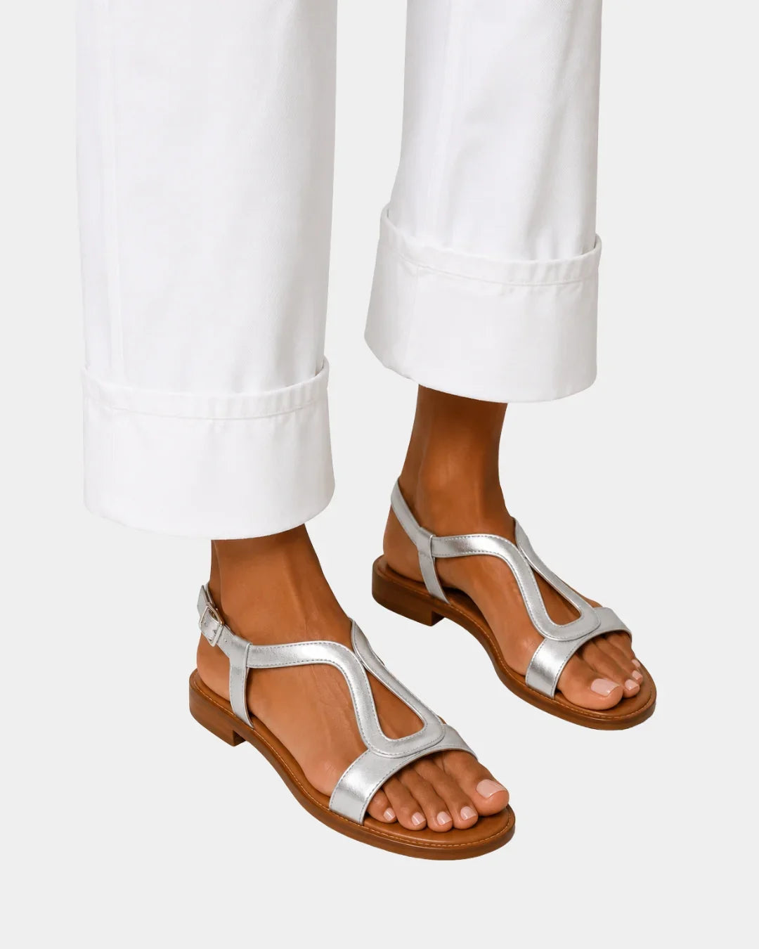 Silver T-strap open-toe sandals with low block heel and ankle strap