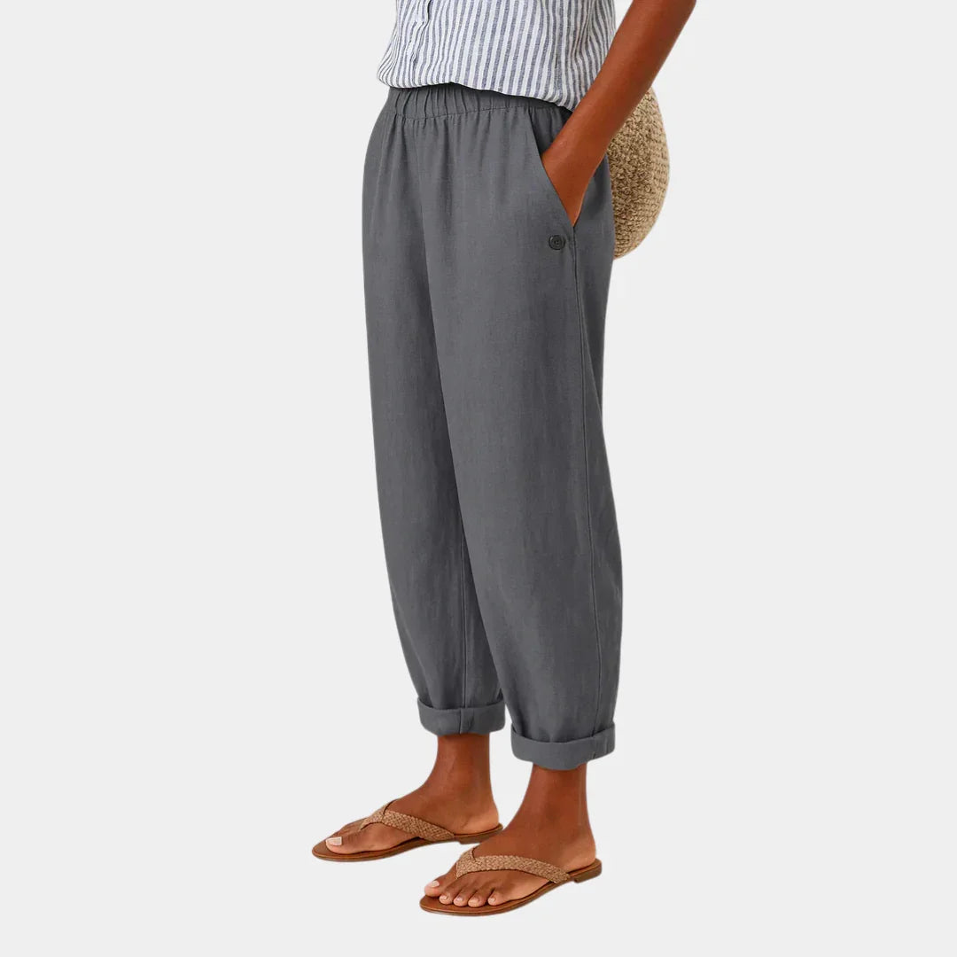 Gray linen-effect pants with elastic waist, button detail, and cuffed ankle hems