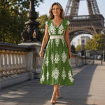 Green baroque-inspired midi dress with white floral medallion print, V-neck, cap sleeves