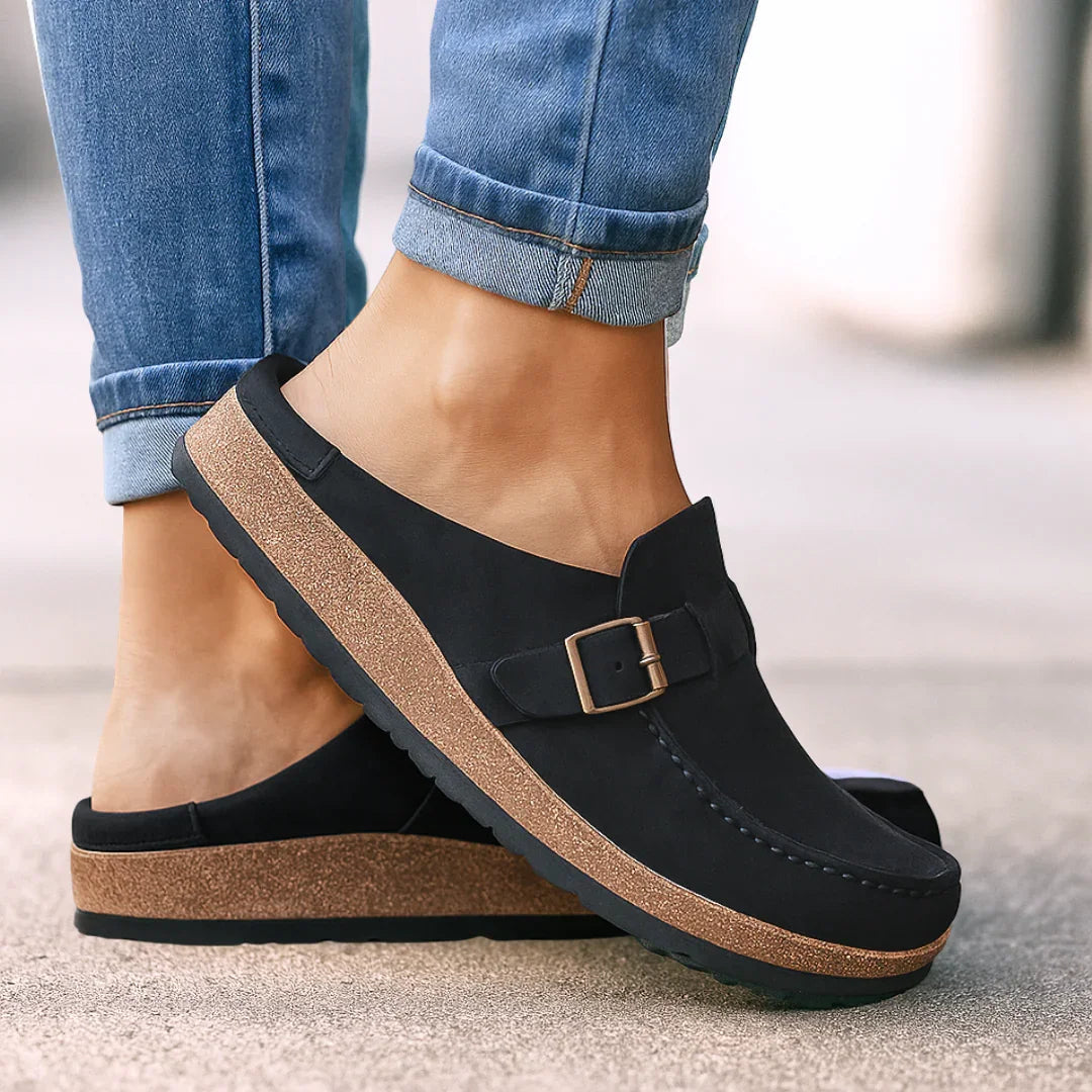 Black orthopedic buckle loafers with side strap and stitched detailing