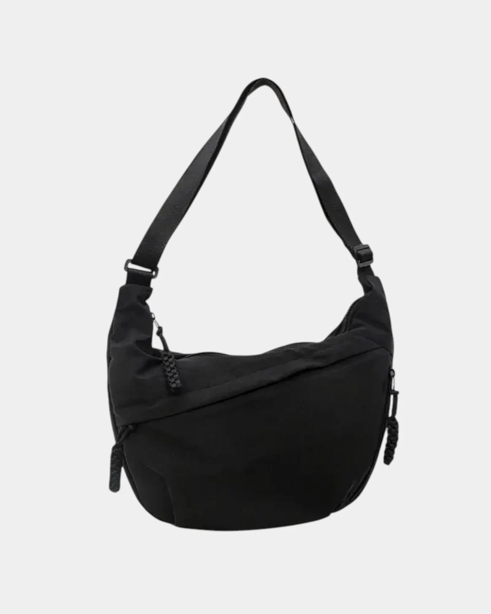 Black anti-theft crossbody bag, curved hobo shape with adjustable strap and zipper pull.