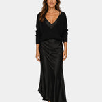Black V-neck dress with blouse top and draped satin midi skirt