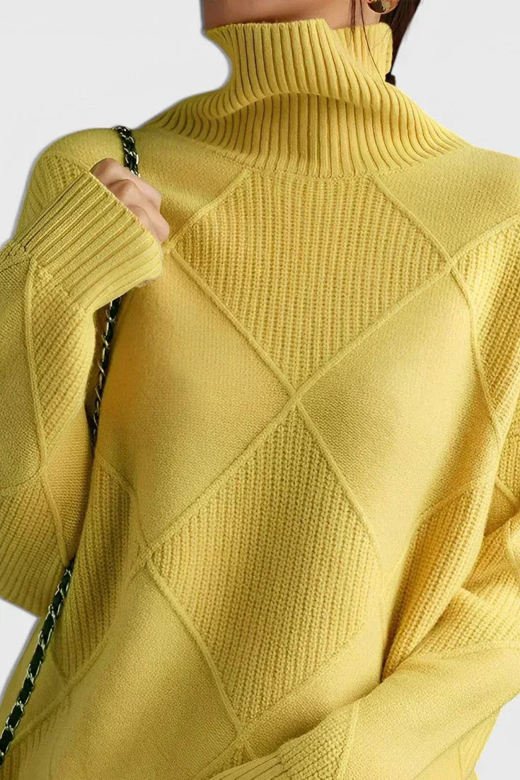Yellow turtleneck sweater with ribbed collar and diamond quilt-like knit pattern