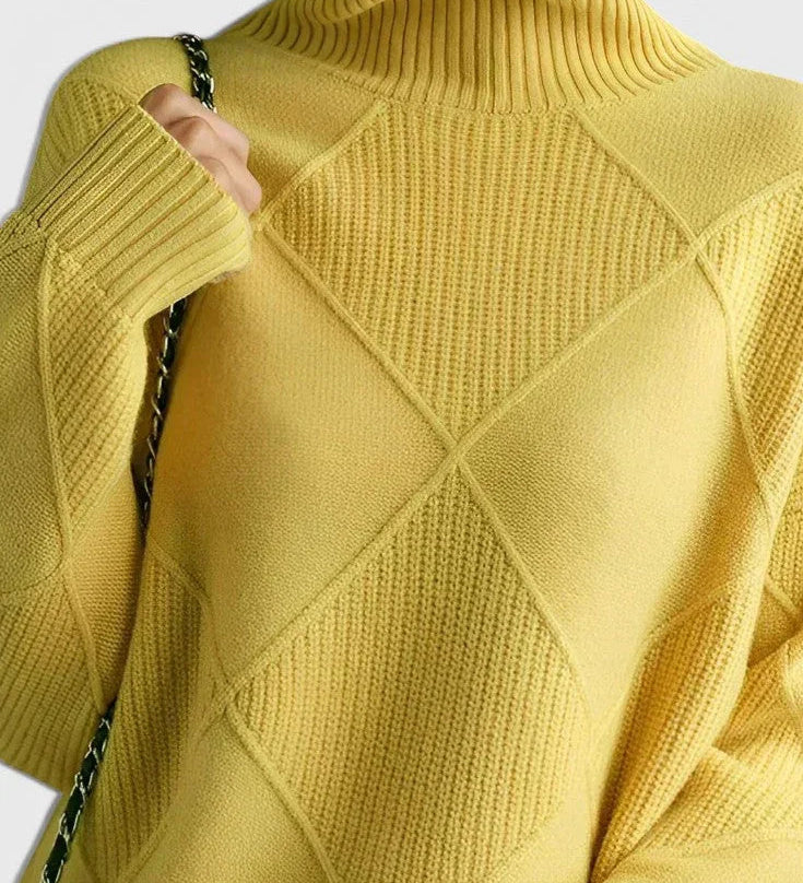 Yellow turtleneck sweater with ribbed collar and diamond quilt-like knit pattern