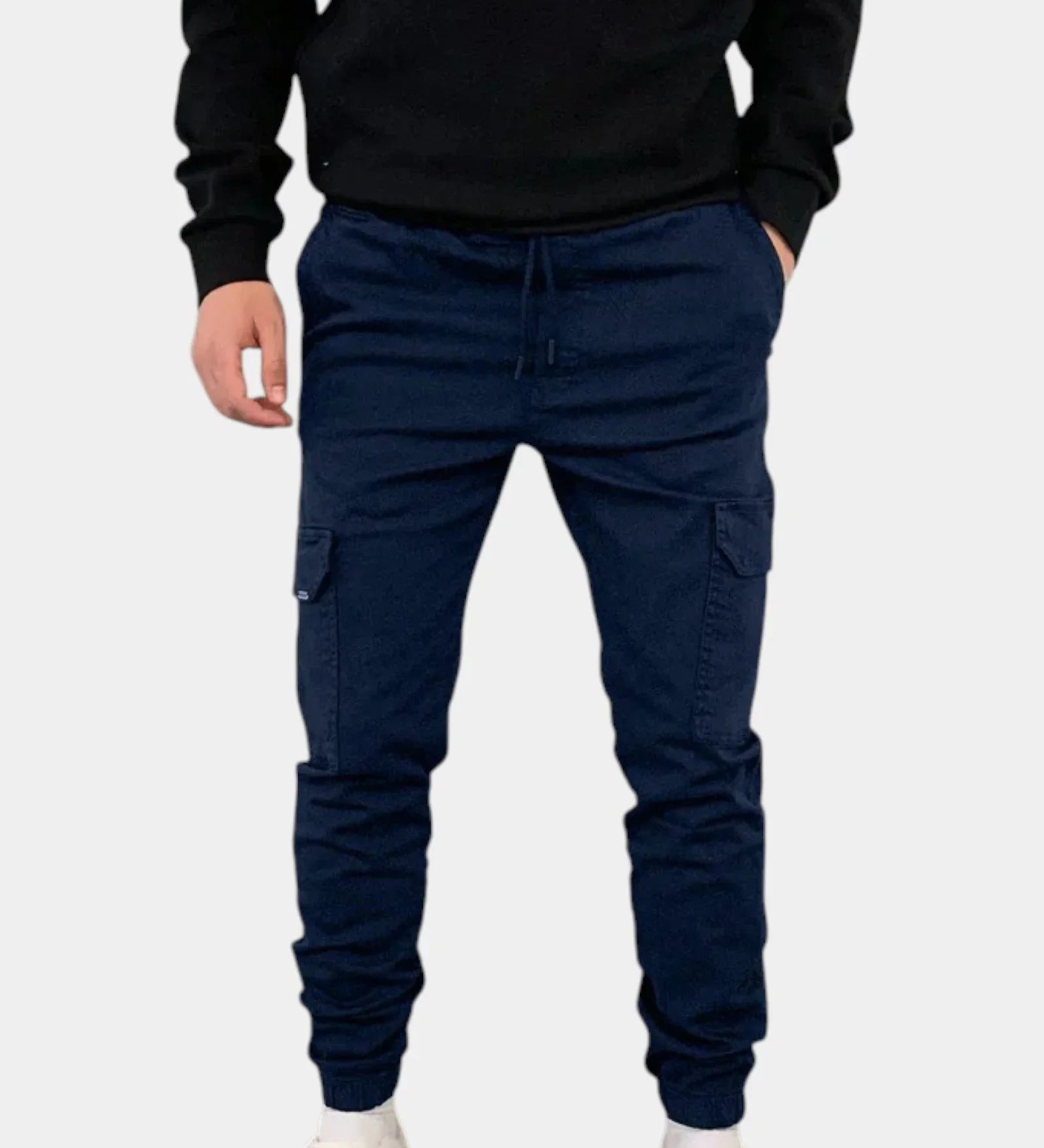 Navy blue cargo jogger pants with drawstring waist, side cargo pockets, elastic cuffs.