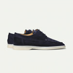 Navy blue suede lace-up loafers, side view, white rubber sole