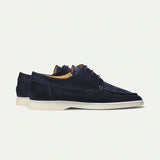 Navy blue suede lace-up loafers, side view, white rubber sole
