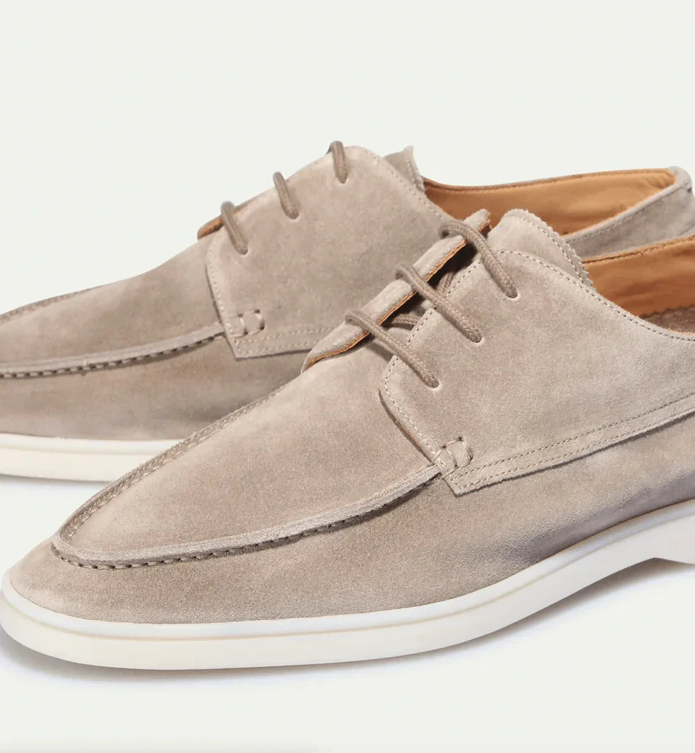 Light beige suede lace-up loafers with stitched seams and low white sole