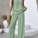 Mint green tiered sleeveless top with floral accents and matching flowy wide-leg pants