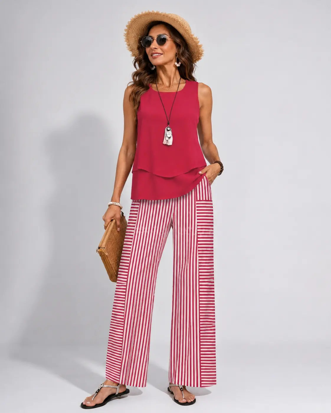 Ramona™ pink sleeveless solid top with ruffled hem and red-striped wide-leg pants