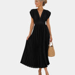Black long flowing pleated dress with V-neck and short flutter sleeves