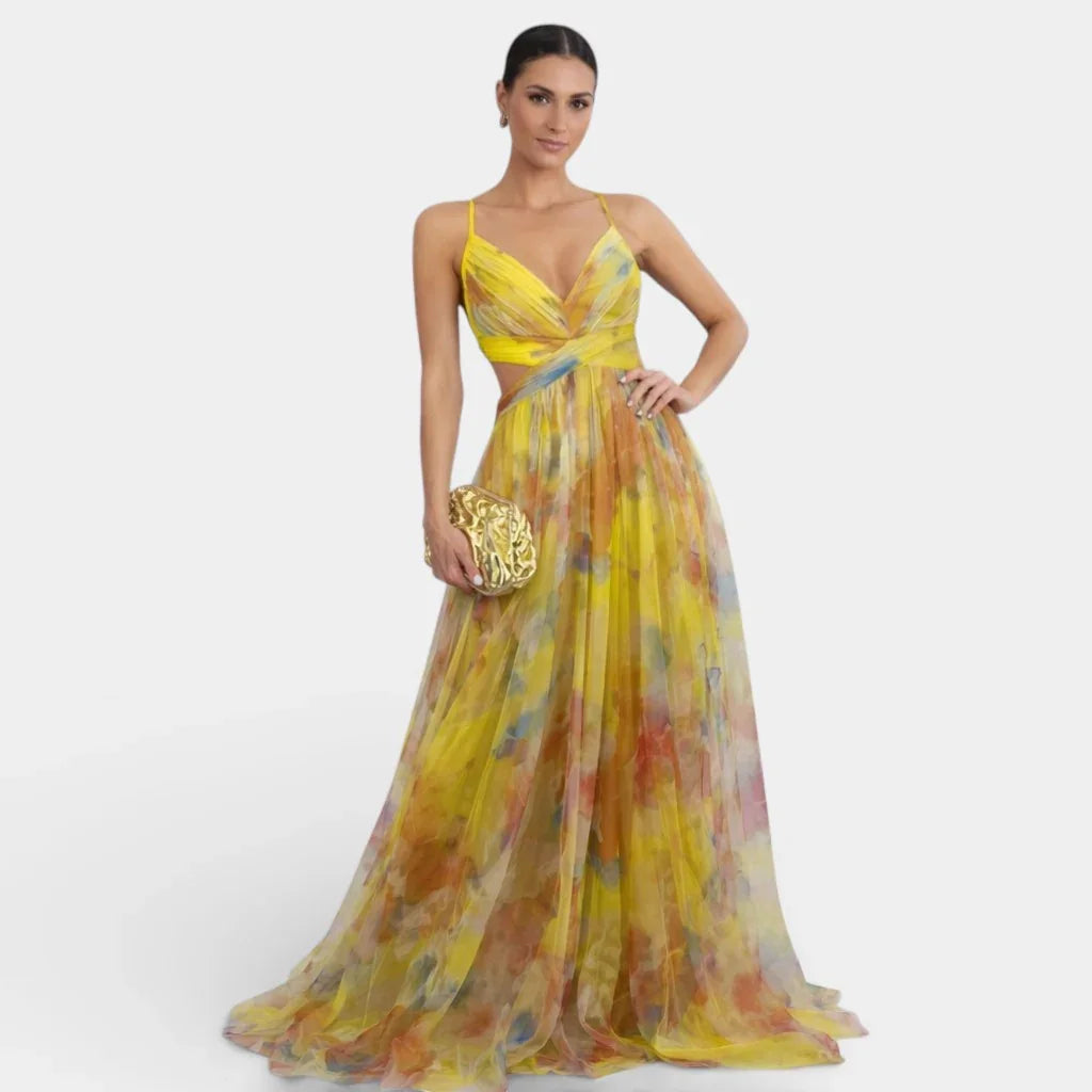 Yellow floral long dress with V-neck, spaghetti straps, and flowing full skirt