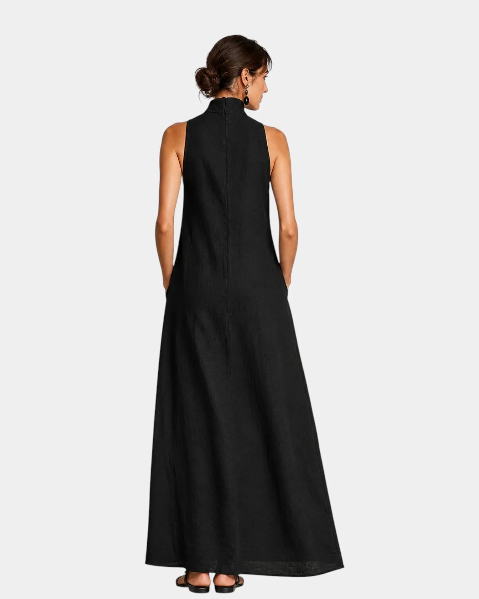 Black sleeveless long minimalist dress, back view with high collar