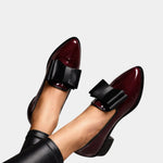 Burgundy loafers with black strap buckle
