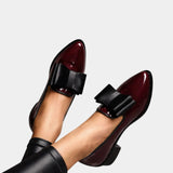 Burgundy loafers with black strap buckle