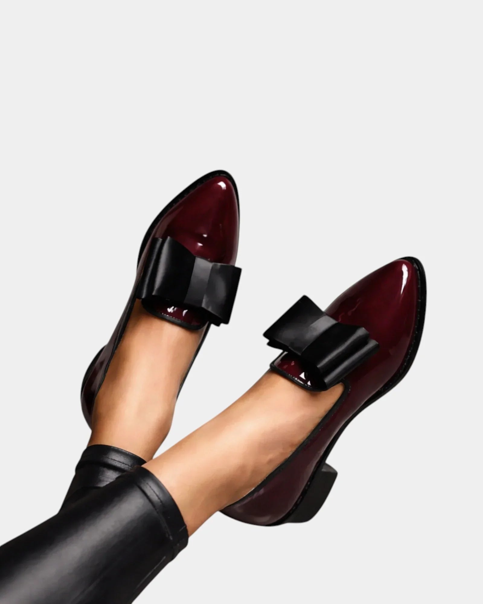 Burgundy loafers with black strap buckle