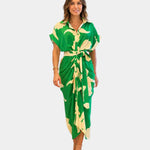 Green patterned casual dress with short sleeves, button front, and tied waist belt