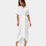 White casual dress with short sleeves, button front, and tied waist sash, asymmetrical hem