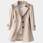 Beige vintage-style coat with notched lapels, button front, and cuffed 3/4 sleeves