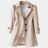 Beige vintage-style coat with notched lapels, button front, and cuffed 3/4 sleeves