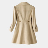 Beige vintage-style coat back view with stitched seams and buttoned sleeve cuffs