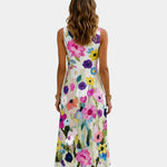 White sleeveless midi dress with colorful floral print, sleeveless back view