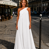 White crossed maxi dress with one-shoulder wrap bodice, sleeveless flowing maxi skirt