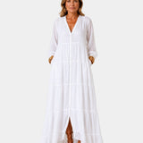 White tiered maxi dress with V-neck, button front, long sleeves, and side slit
