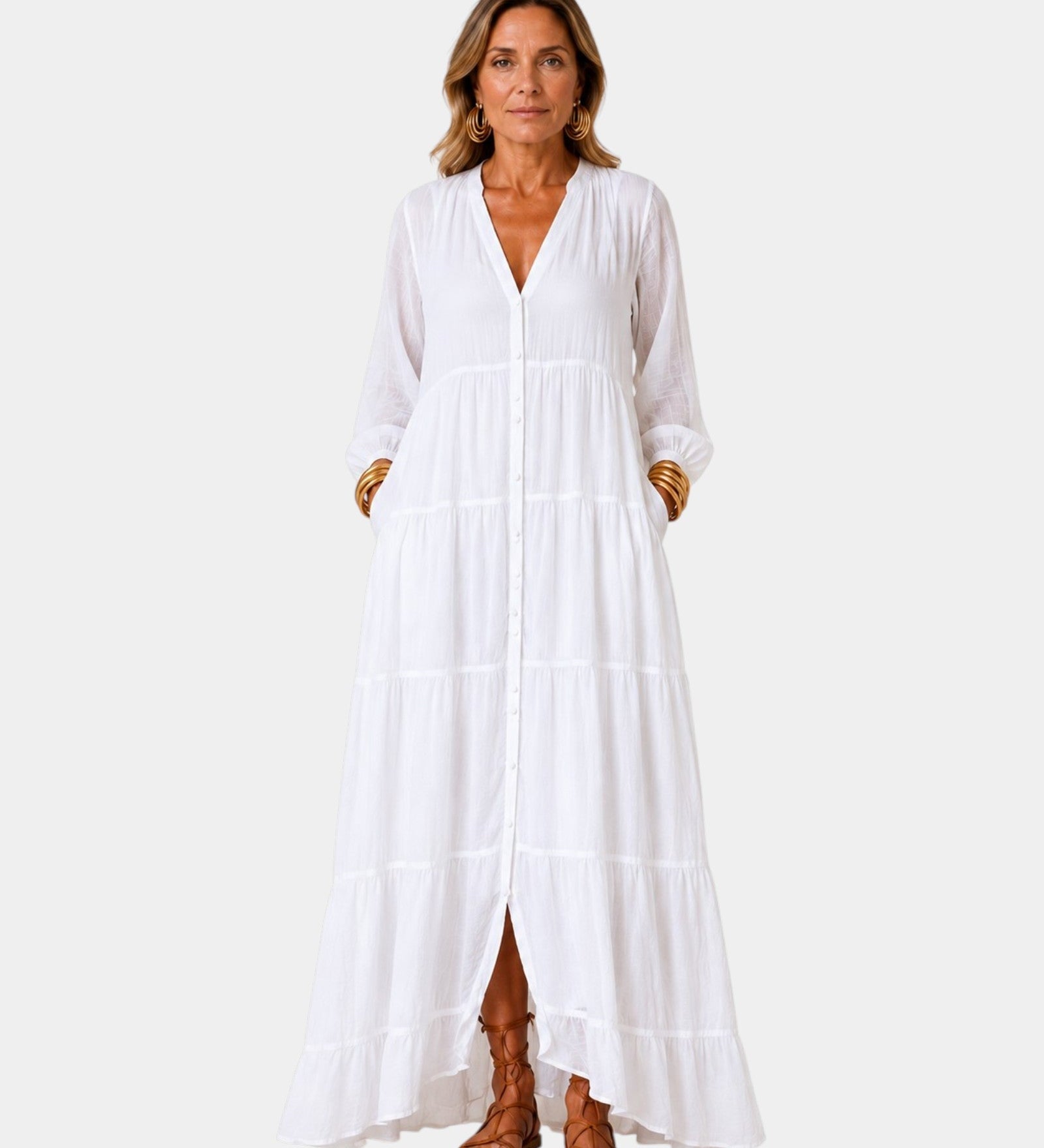 White tiered maxi dress with V-neck, button front, long sleeves, and side slit