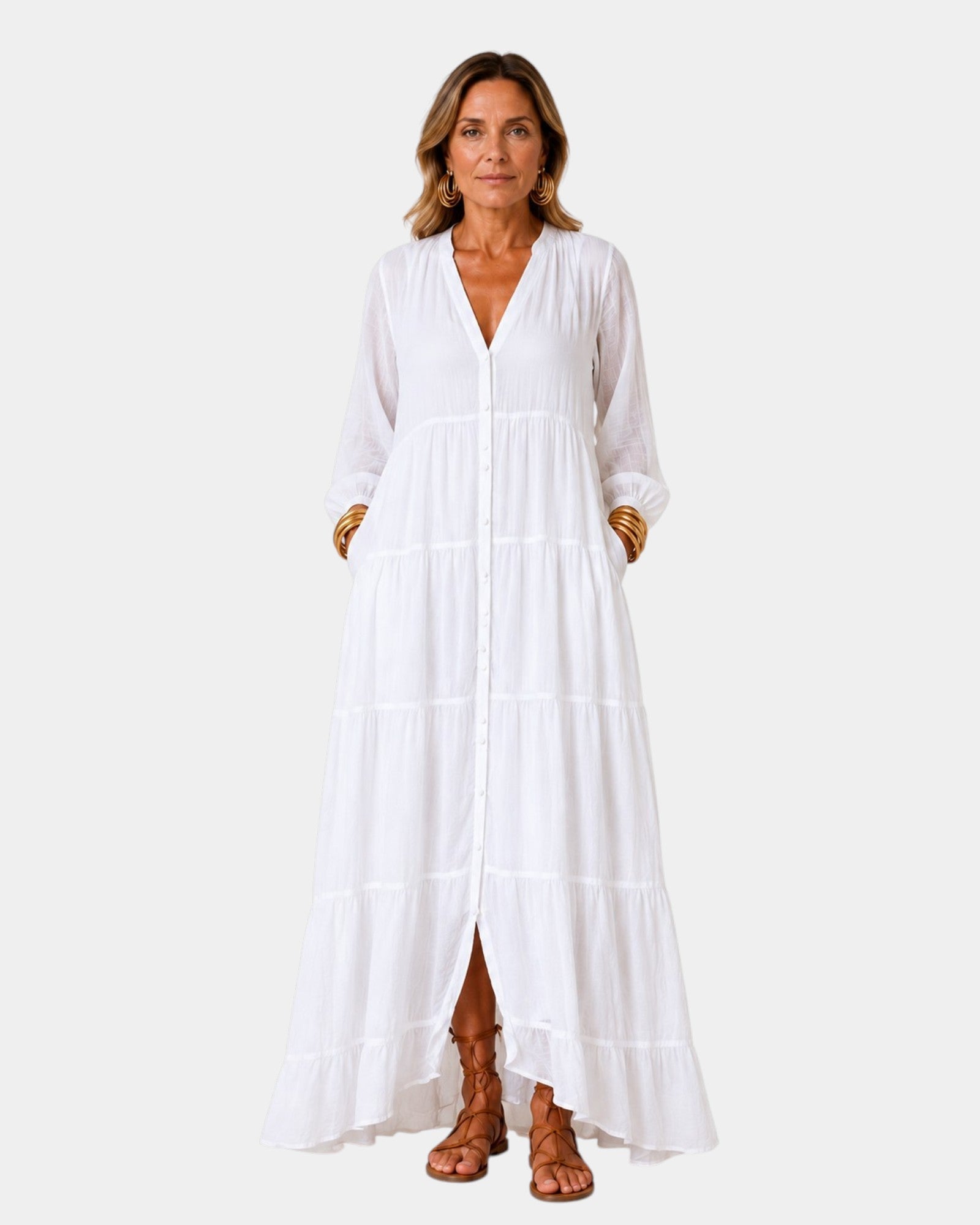 White tiered maxi dress with V-neck, button front, long sleeves, and side slit