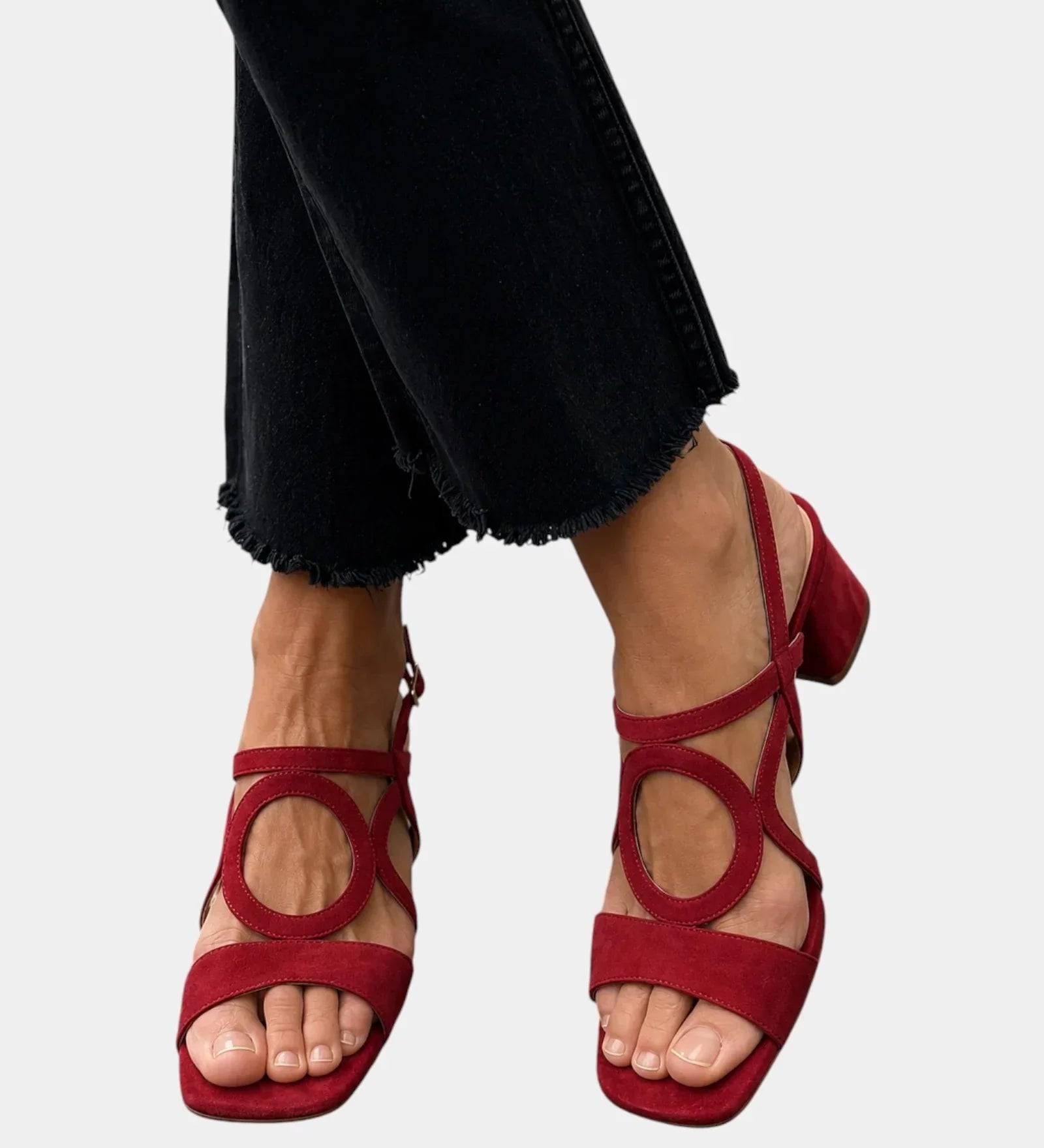 Red square-toe sandals with rounded cutout straps and ankle buckle