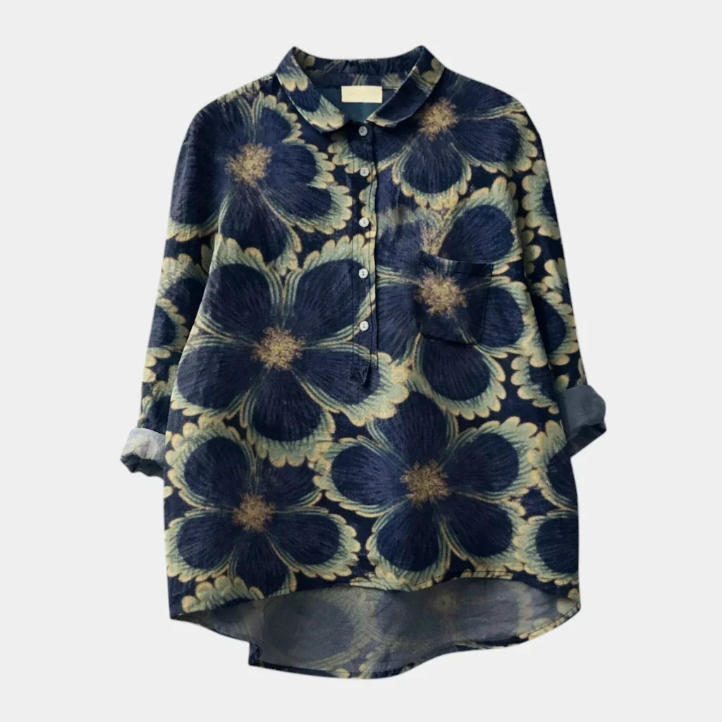 Blue floral patterned button-up shirt with long sleeves and front buttons