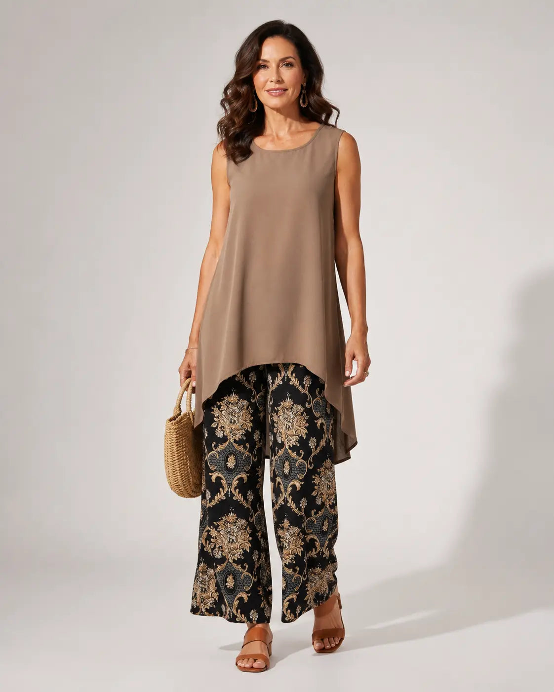 Sleeveless taupe tunic with asymmetrical hem and black gold paisley wide-leg pants set