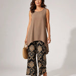 Sleeveless taupe tunic with asymmetrical hem and black gold paisley wide-leg pants set