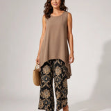 Sleeveless taupe tunic with asymmetrical hem and black gold paisley wide-leg pants set