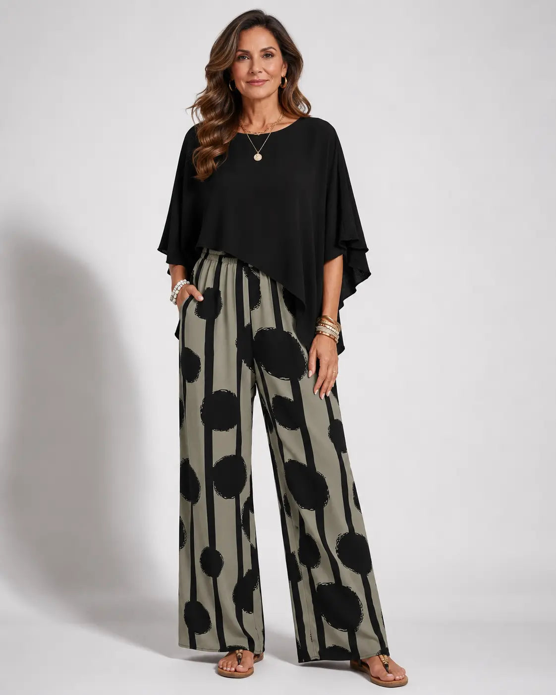 Black asymmetrical blouse with batwing sleeves and wide-leg boho pants, black-on-cream dot print