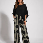 Black asymmetrical blouse with batwing sleeves and wide-leg boho pants, black-on-cream dot print