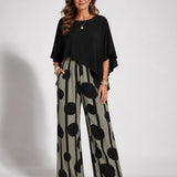 Black asymmetrical blouse with batwing sleeves and wide-leg boho pants, black-on-cream dot print