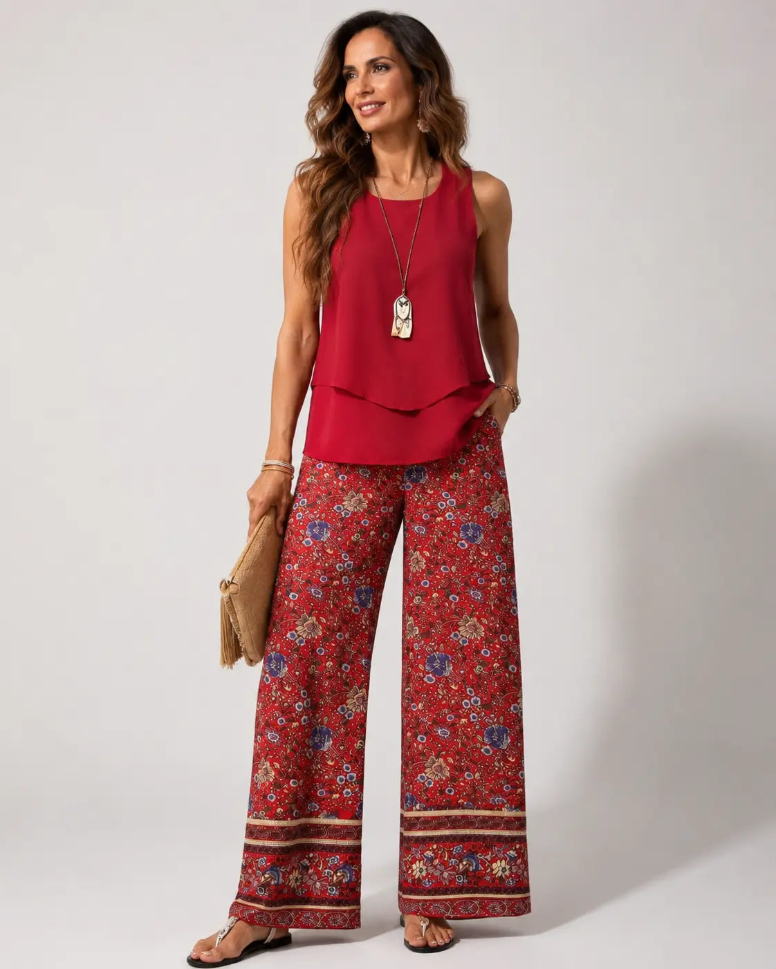 Red sleeveless layered boho top with floral wide-leg pants