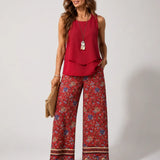 Red sleeveless layered boho top with floral wide-leg pants