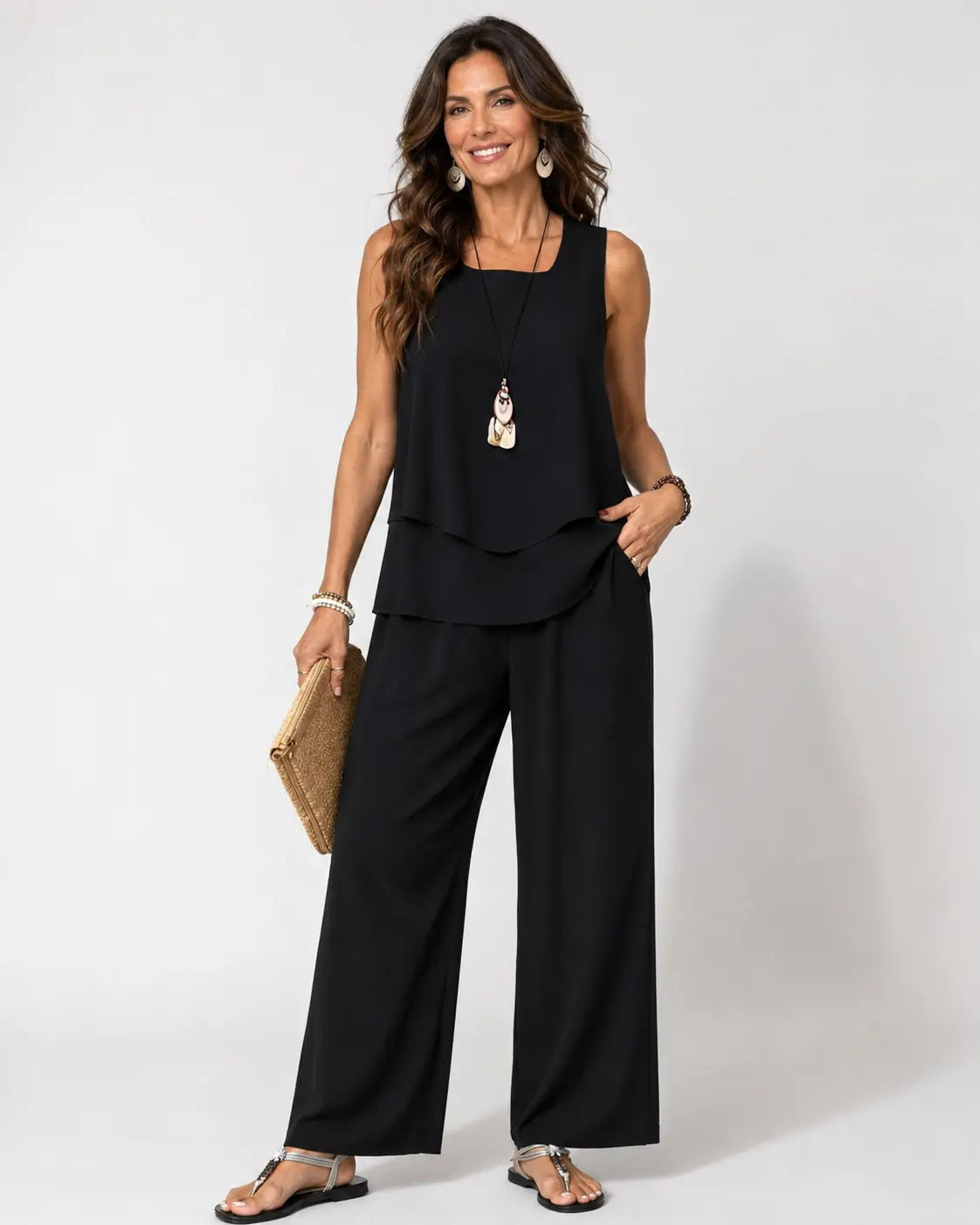Black layered sleeveless top with wide-leg pants, relaxed two-tier hem