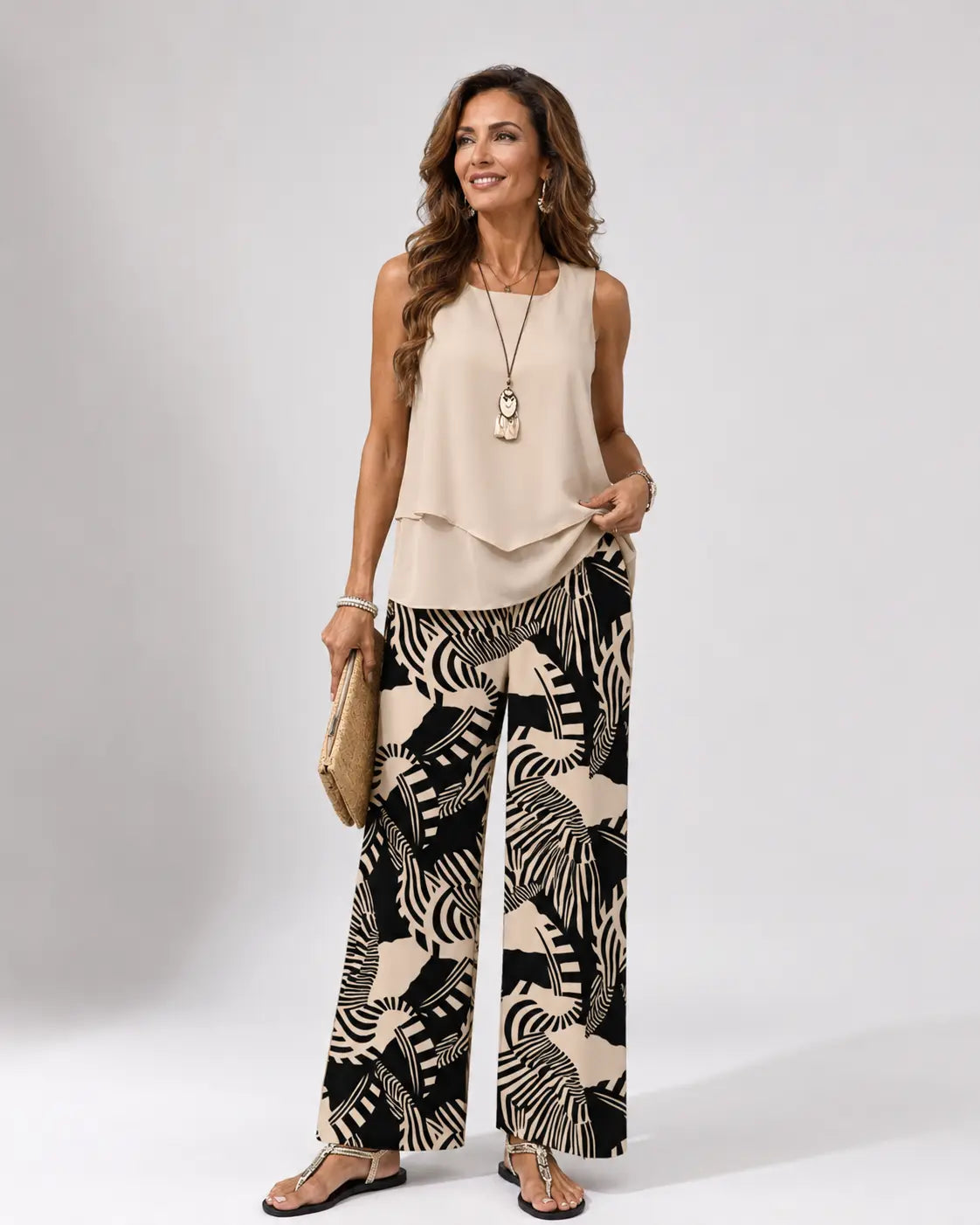 Ignacia™ beige sleeveless layered top with black-and-cream plant print wide-leg pants set