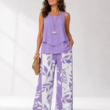 Lilac sleeveless layered blouse with botanical print wide-leg trousers, full length